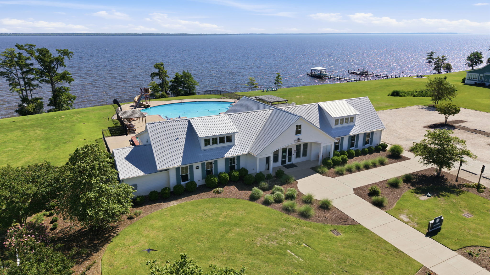 Aerial view of the Occano clubhouse, pool, and dock