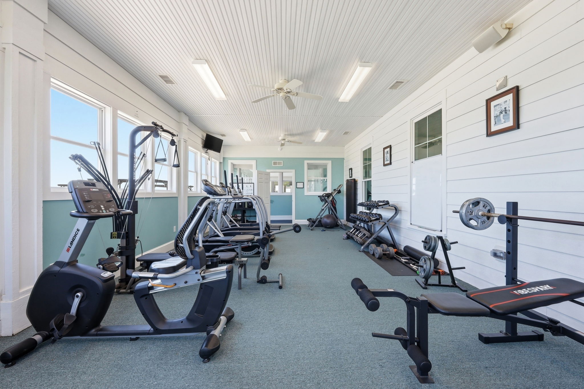 Interior of the fitness center at the Occano River Club, with cardio and weight equipment