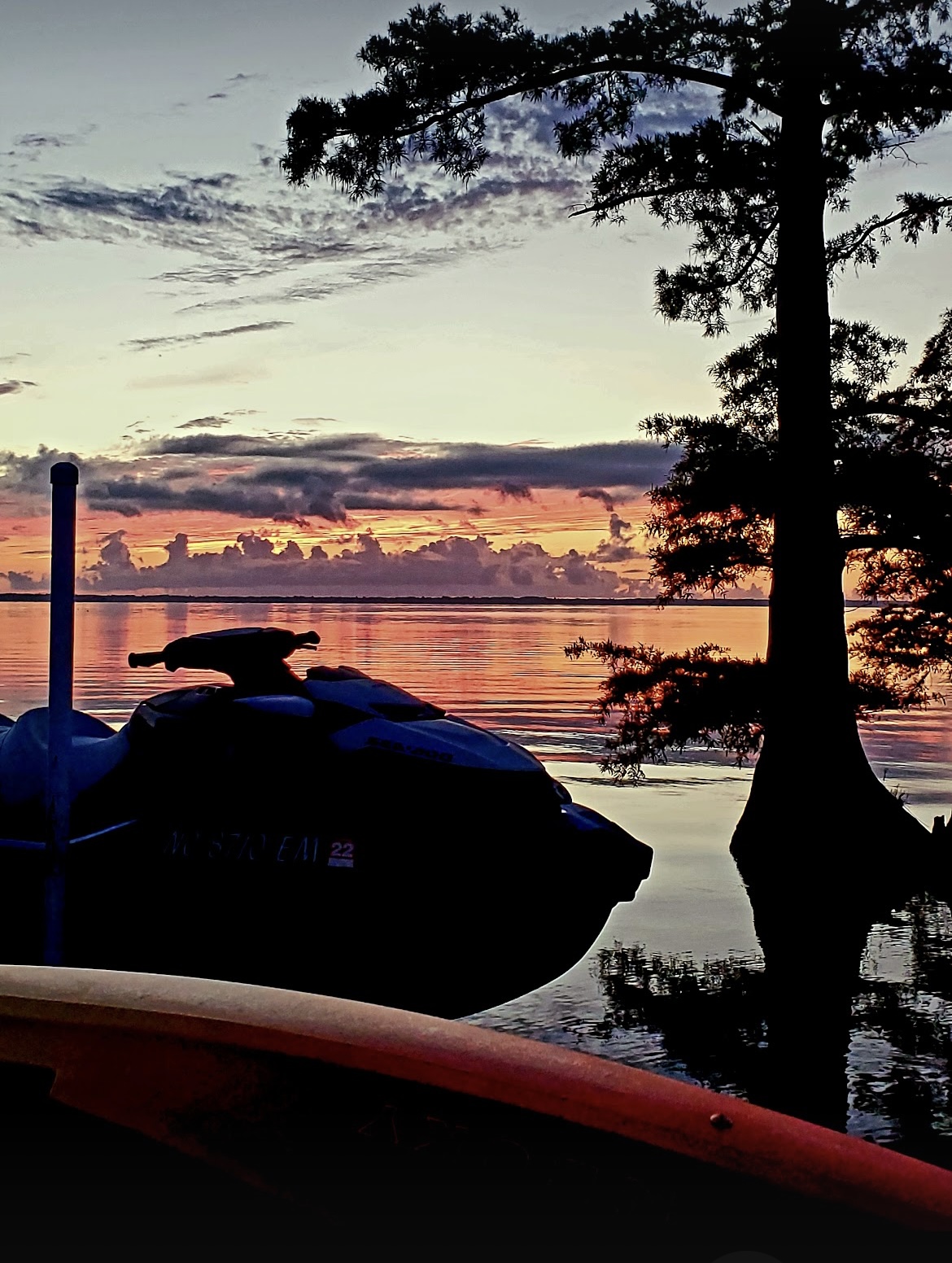 Sunset over the Albemarle Sound with a jet ski at the dock